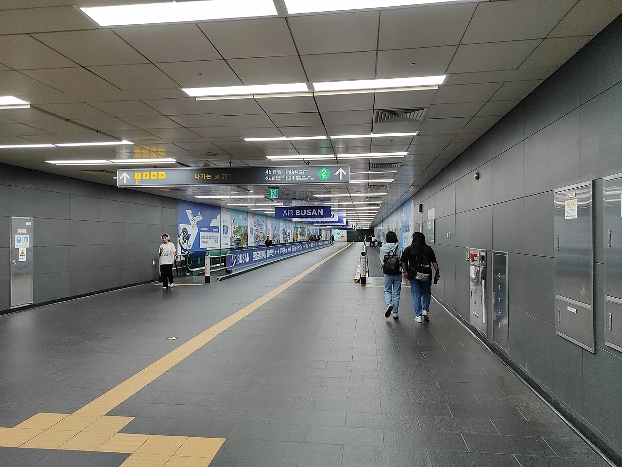 A long underground walkway inside a Seoul subway station