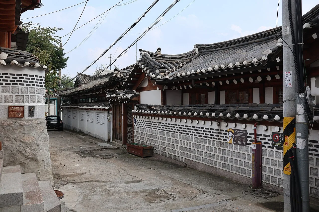 Close-up of tiled hanok roofs and wooden eaves in Bukchon Hanok Village