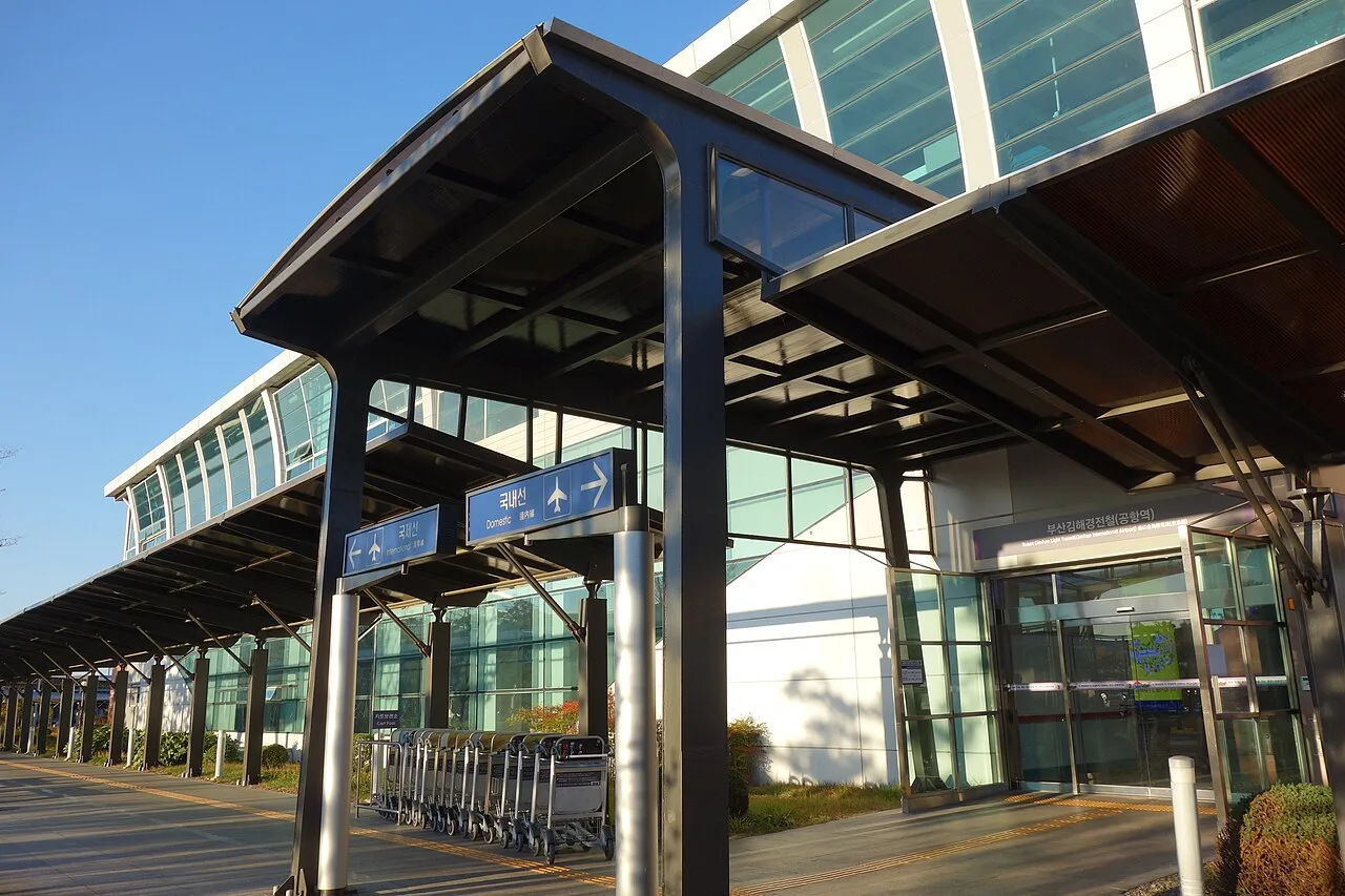 Covered walkway and entrance to the Busan-Gimhae Light Rail station at Gimhae International Airport