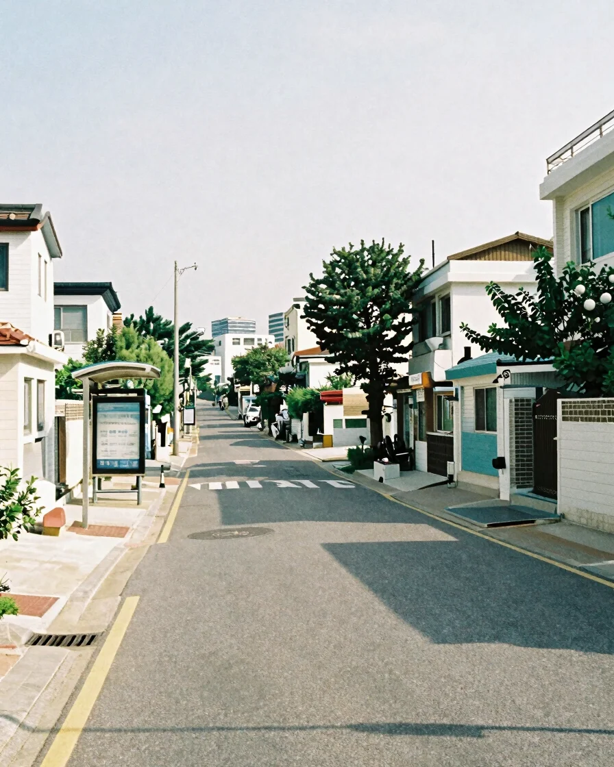 Wide, soft daylight photograph of an ordinary Seoul residential s