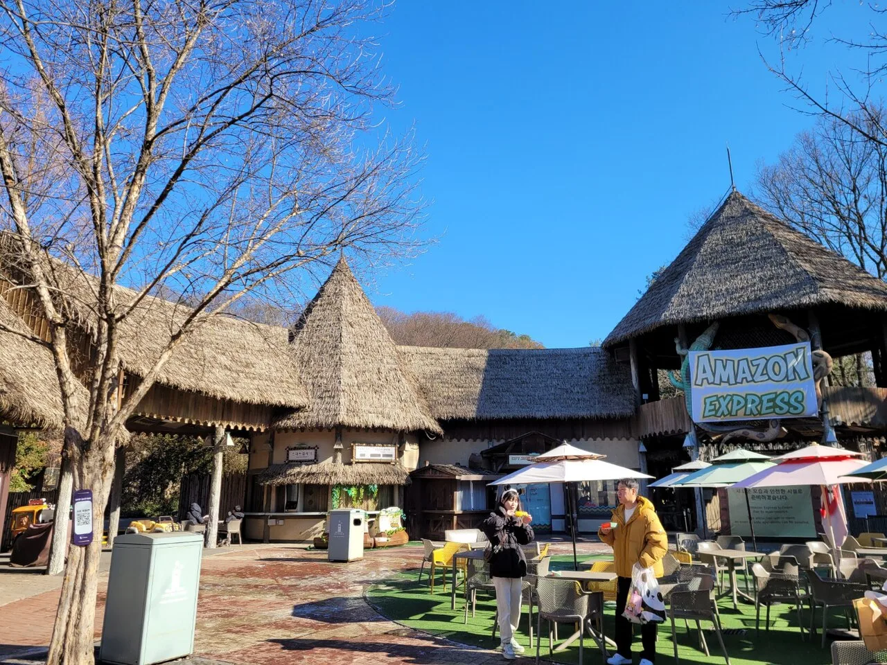 The thatched-roof Amazon Express ride area at Everland on a sunny winter day