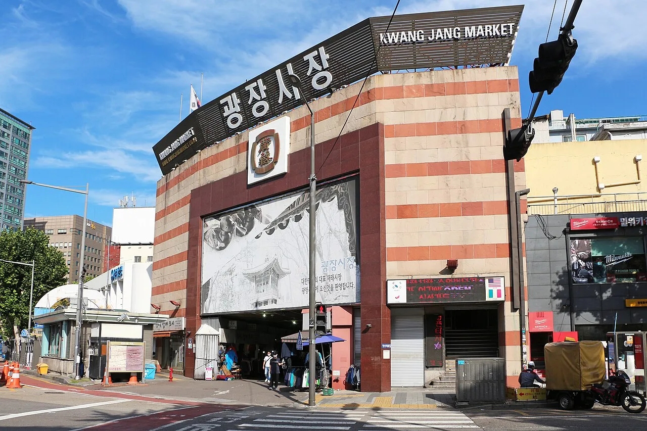 The front entrance of Gwangjang Market with its large Korean sign