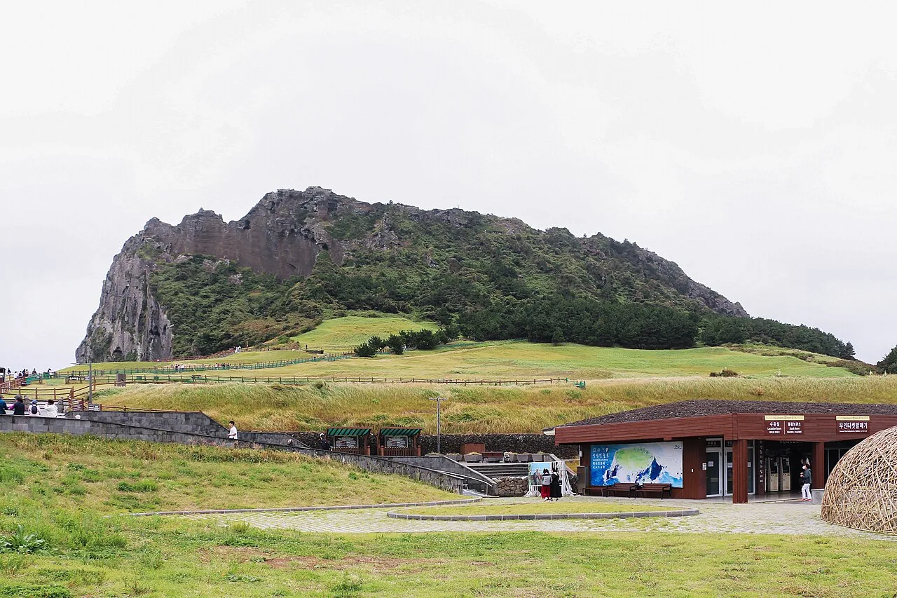 Seongsan Ilchulbong tuff cone rising from the sea on Jeju's east coast