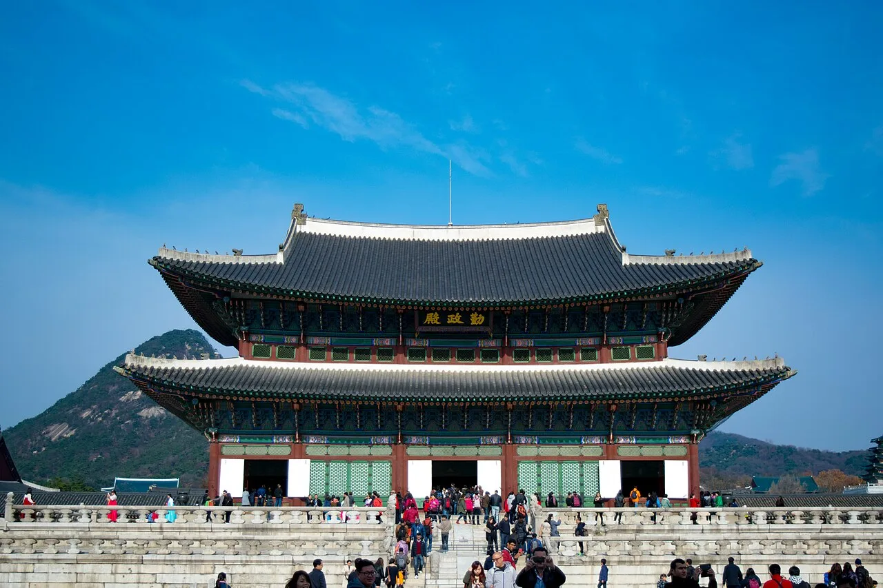 Geunjeongjeon throne hall of Gyeongbokgung Palace with mountains behind