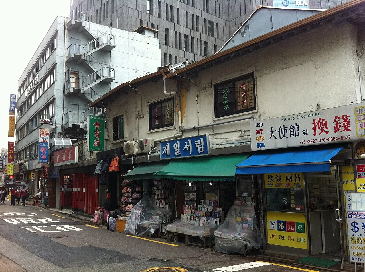 Myeongdong shop fronts with cosmetics and tax-free signs on a summer day