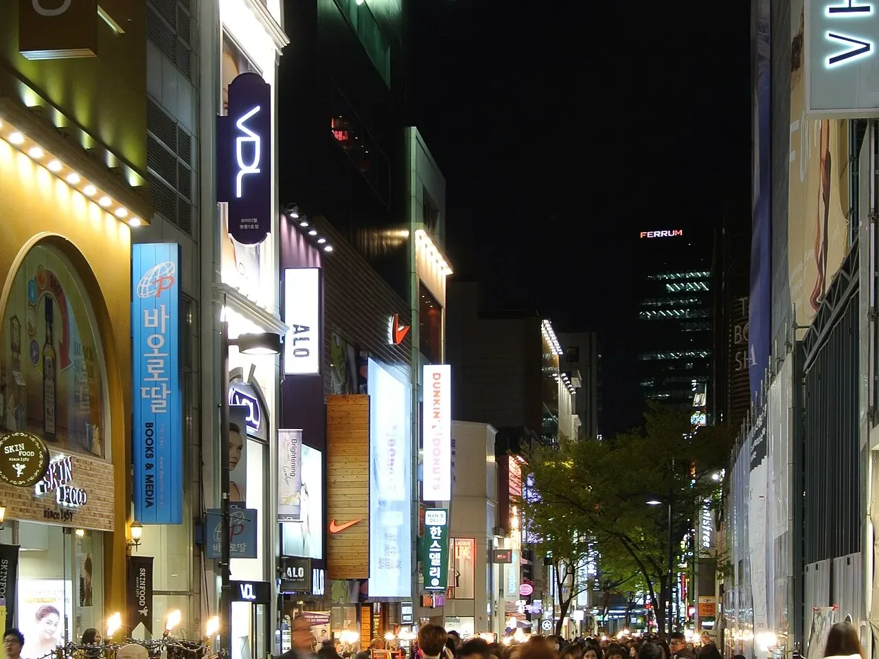 Myeongdong shopping street at night lined with cosmetics shops