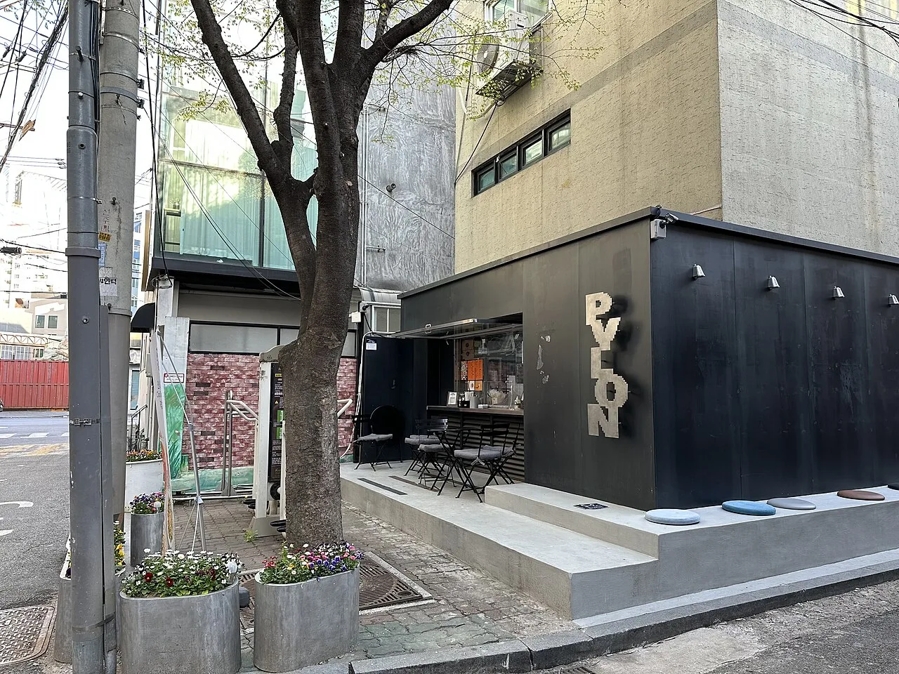 Minimalist café storefront with large windows in Seongsu-dong
