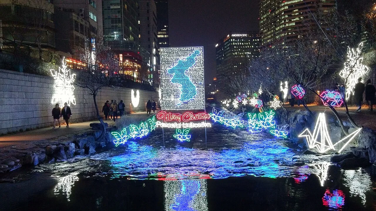 Light sculptures and decorations along Cheonggyecheon Stream at night during a December festival