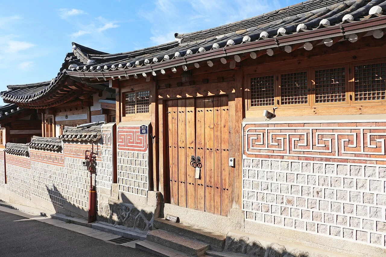 Traditional hanok houses with tiled roofs and wooden doors in Bukchon
