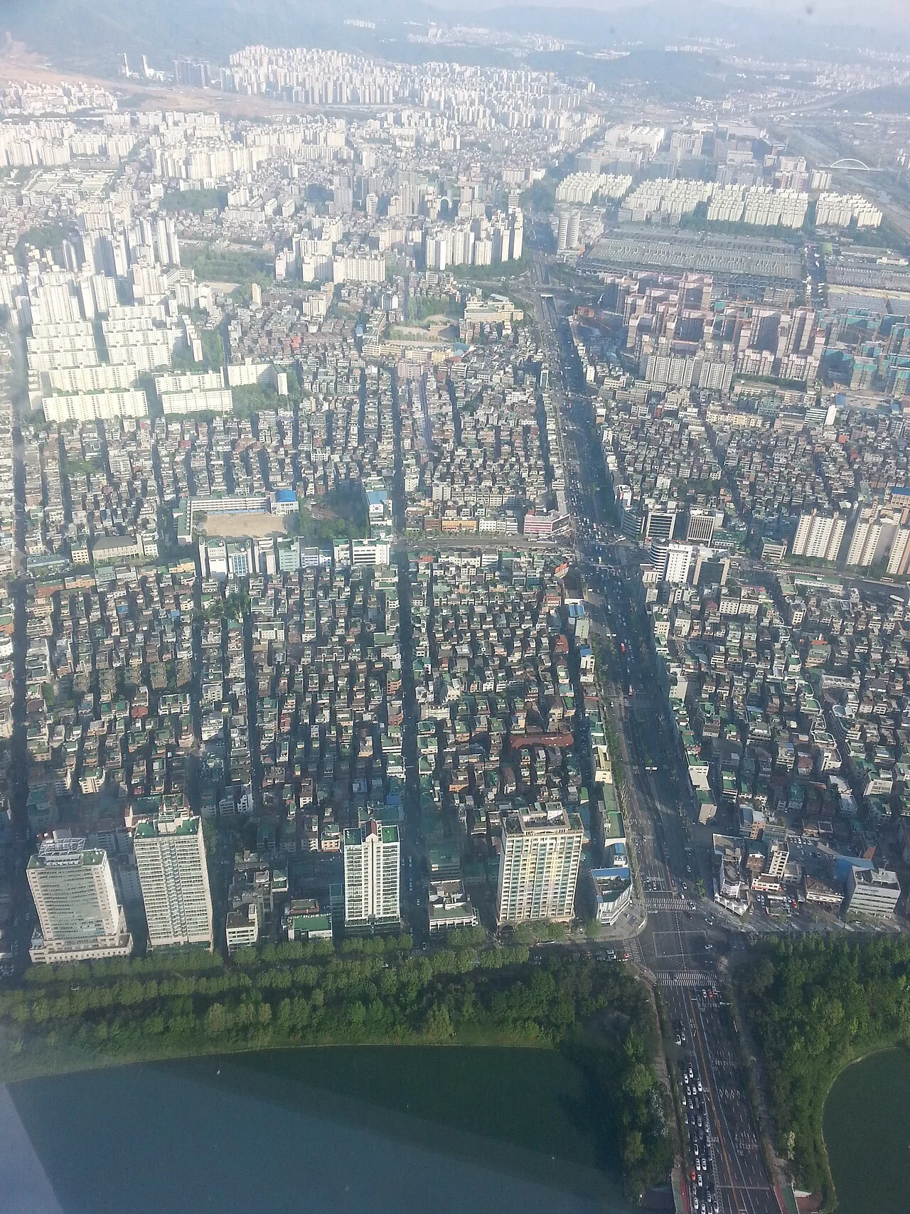 View from Lotte World Tower over Seokchon Lake and the Lotte World theme park in Seoul