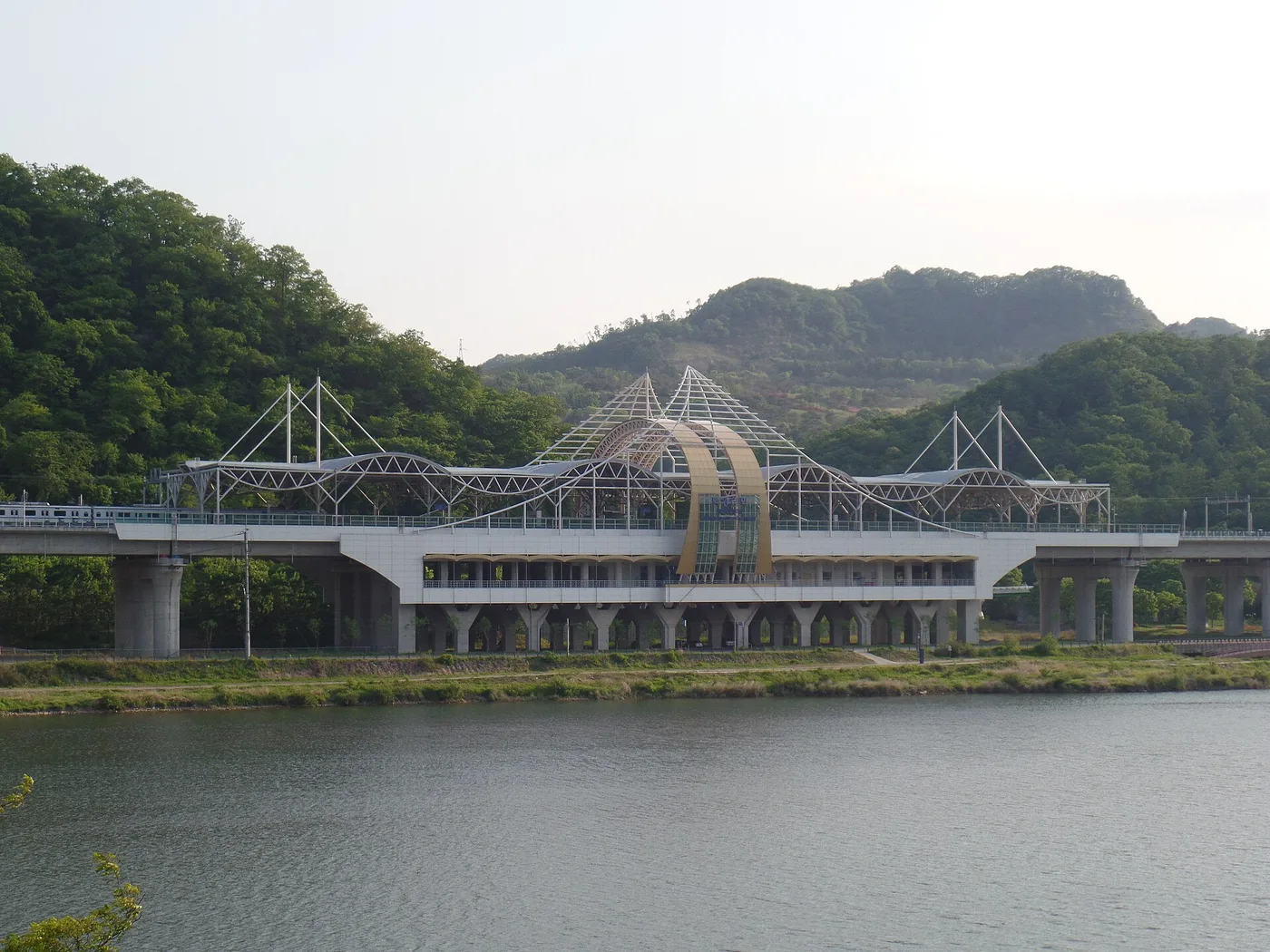 Baegyang-ri Station on the Gyeongchun Line beside a river with green hills