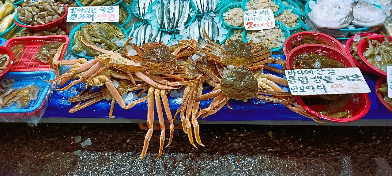 Fresh crabs and seafood on display at a stall in Mangwon Market, Seoul