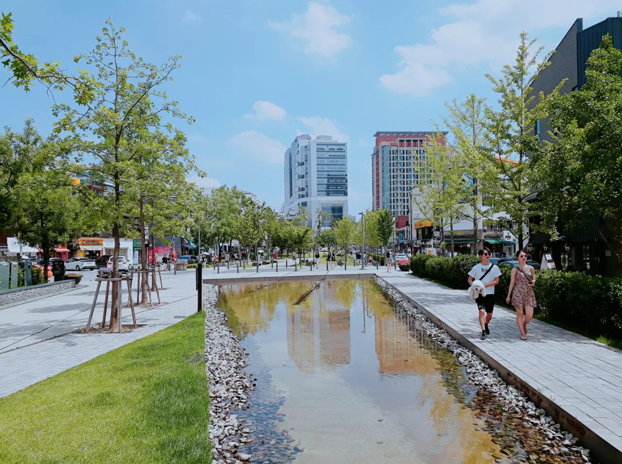 People relaxing on the lawns of Yeontral Park in Yeonnam-dong